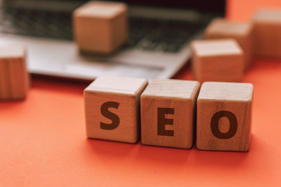 Wooden blocks spelling SEO on a laptop keyboard convey digital marketing concepts. - search engine optimization - Google SEO