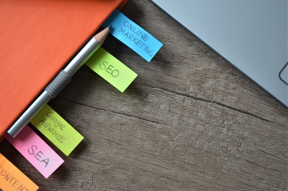 Close-up of SEO strategy planner with colorful sticky notes and a pencil on a notebook. - search engine optimization - Google SEO