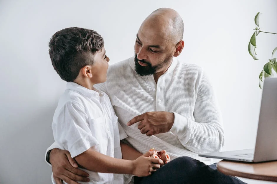 A touching scene of a father and son engaging in a deep conversation at home. - parentchild communication