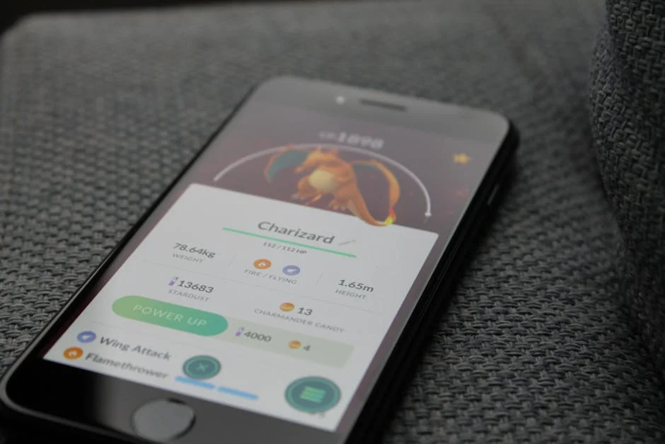 Smartphone displaying Pokémon GO screen with Charizard, highlighting gaming technology. - pubg mobile gameplay